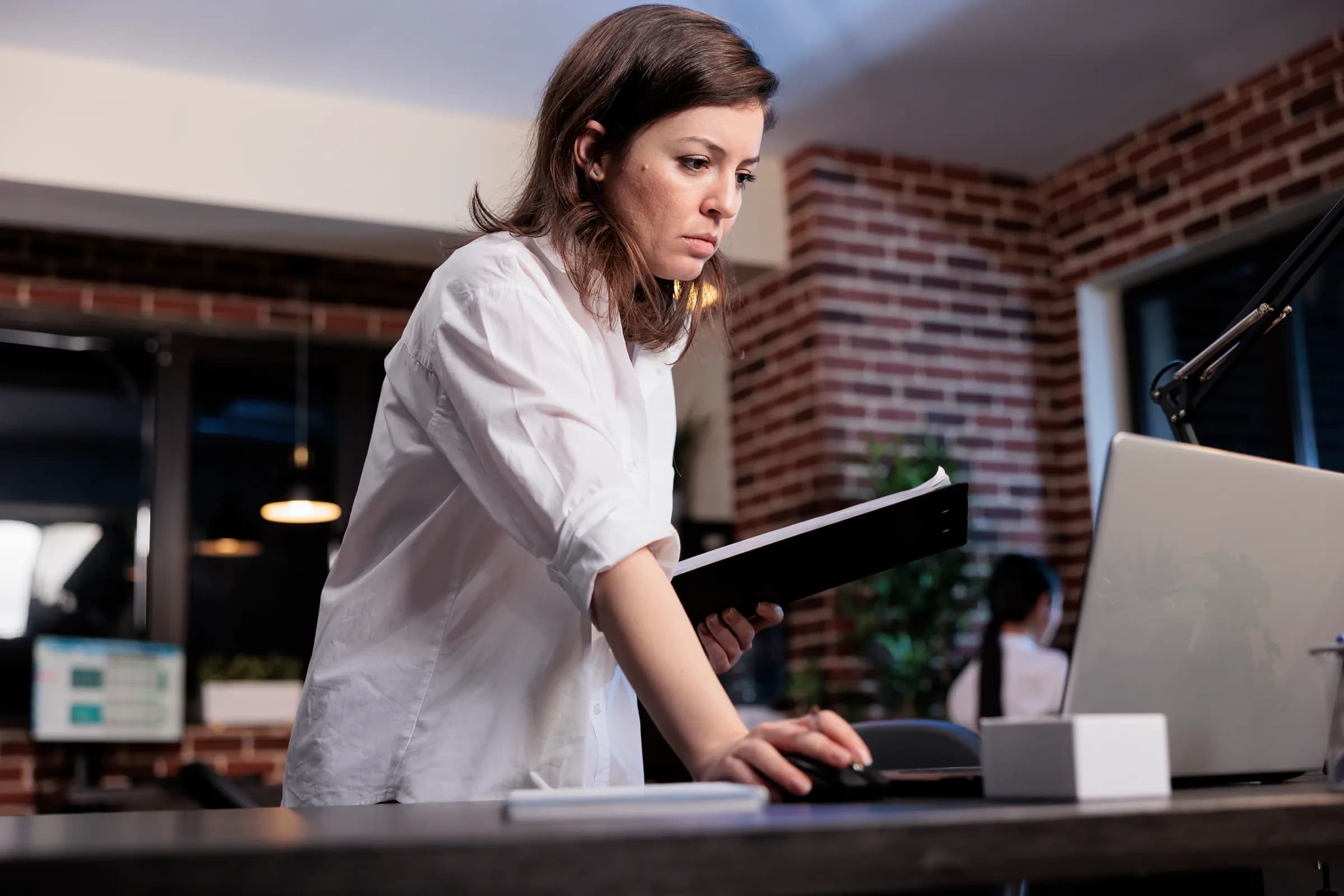 A professional researching UK government procurement frameworks on a laptop